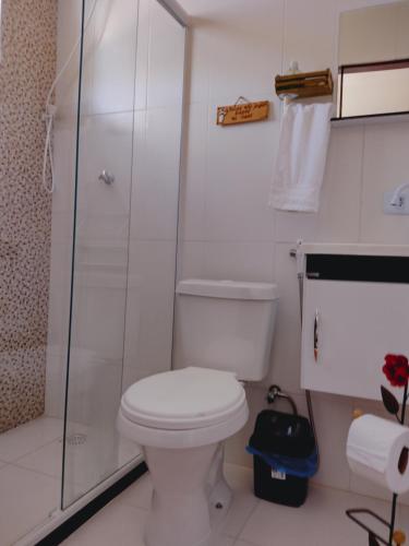a bathroom with a toilet and a shower at Saquaflats in Saquarema