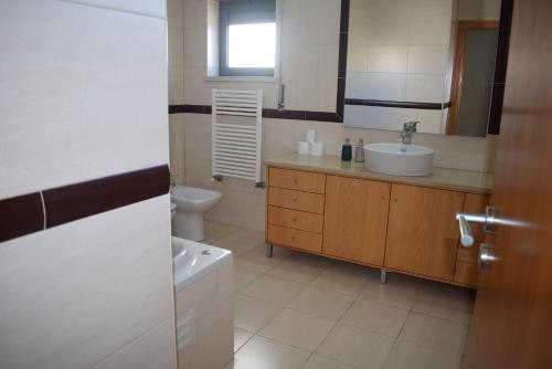Ванна кімната в Vila Oceânica 2
