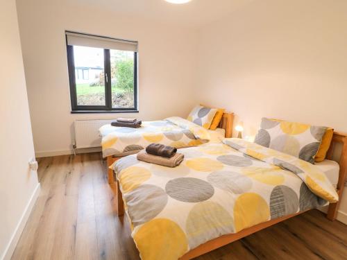 a bedroom with two beds and a window at Rockville in Greencastle