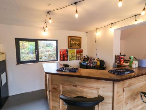 a bar in a room with a counter and a chair at Rockville in Greencastle