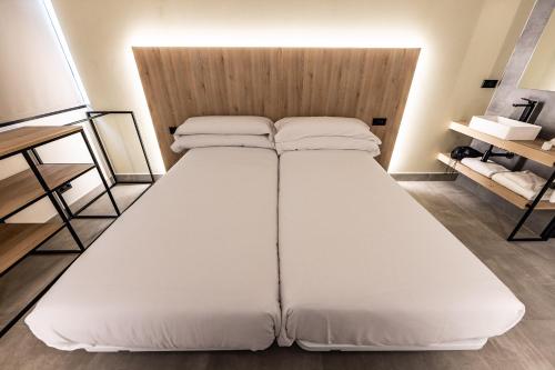 Hospedium Hotel Devalar Do Marにあるベッド