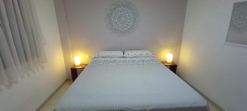 מיטה או מיטות בחדר ב-Estudio - descanso y bienestar en La Punta