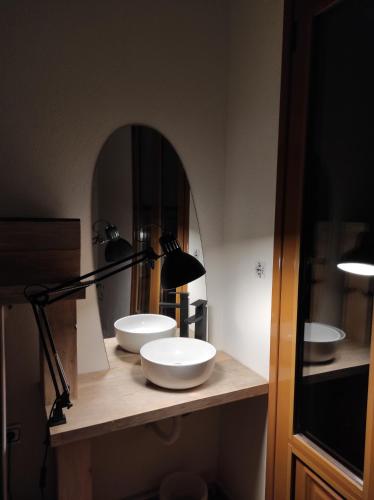 a bathroom with two sinks on a counter with a mirror at 180 mountain lodge in Ioannina