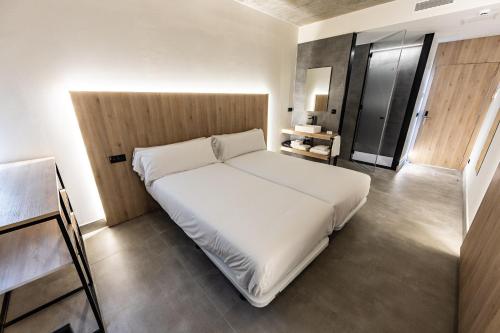 Hospedium Hotel Devalar Do Marにあるベッド