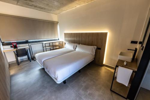 Hospedium Hotel Devalar Do Marにあるベッド