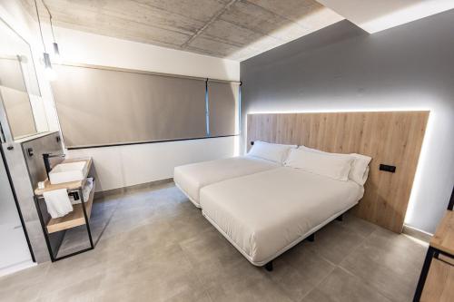 Hospedium Hotel Devalar Do Marにあるベッド