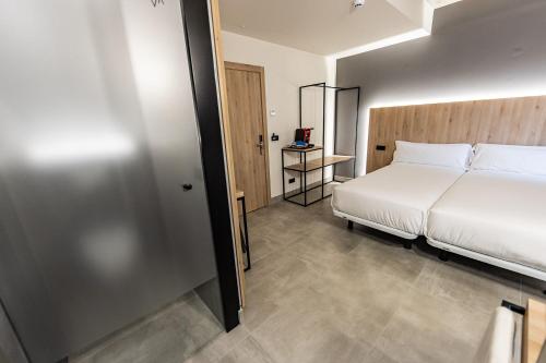 Hospedium Hotel Devalar Do Marにあるベッド