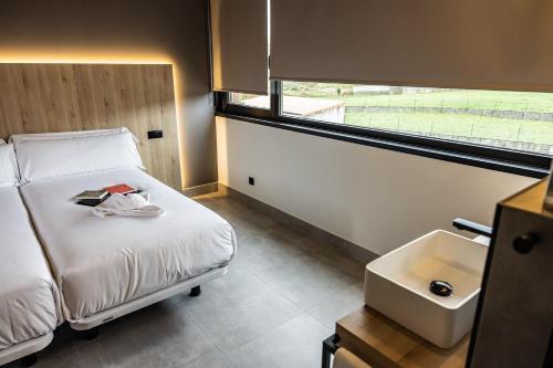 Hospedium Hotel Devalar Do Marにあるベッド