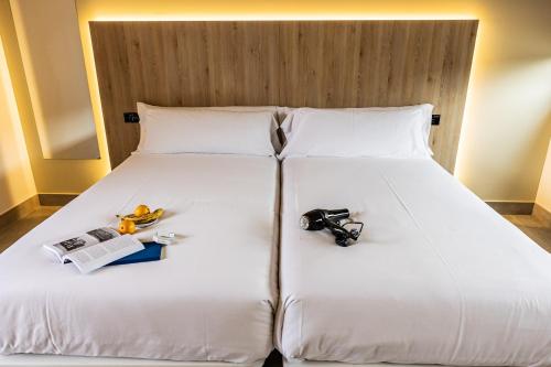 Hospedium Hotel Devalar Do Marにあるベッド