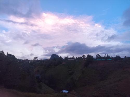 a view of a hill with a cloudy sky at Apartamento La bonita guatape in Guatapé