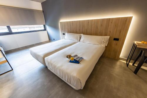 Hospedium Hotel Devalar Do Marにあるベッド