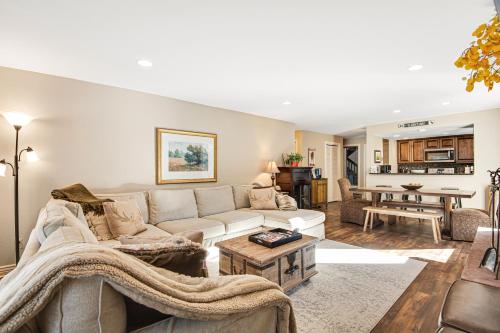 a living room with a couch and a table at Timber Falls 3/2 condo in E Vail 4480 Timber Falls Ct, #1504, Vail, CO 81657 in Vail