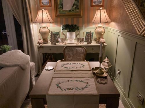 a living room with a table and a couch at Ballybur Lodge Mews 1 in Kilkenny