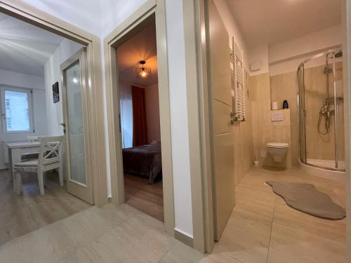 a bathroom with a walk in shower and a walk in shower at Luxury Q Residence Near Center in Iaşi
