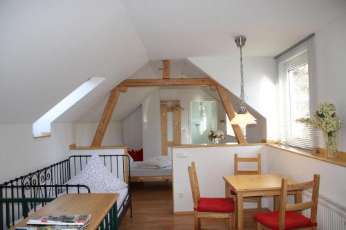 a room with a table and a dining room at Hotel Anchovis in Mönchengladbach