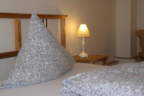 a bed with a pillow shaped like a pineapple at Hotel Anchovis in Mönchengladbach
