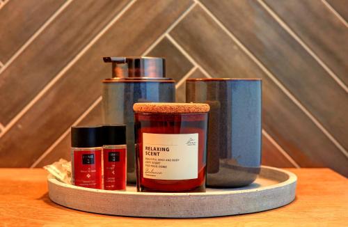 a tray with four bottles of essential oils on a table at KOKICHE 4 Friends, Borovets in Borovets