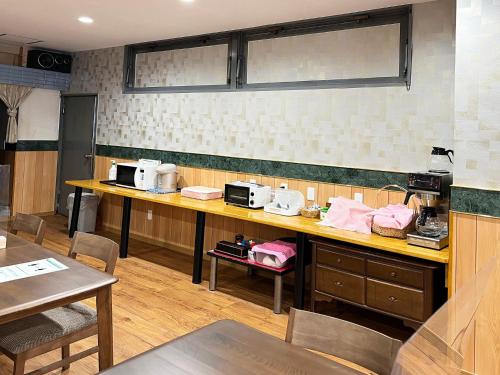 a kitchen with a counter with two microwaves on it at Hotel Bayside Mihara - Vacation STAY 00520v in Mihara