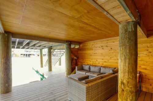 a wooden room with a couch on a deck at Marsden Lake Resort Central Otago in Cromwell