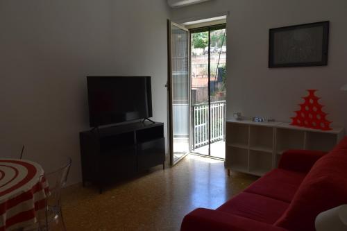 A television and/or entertainment centre at Zio Romano Apartment Rome - Vatican area