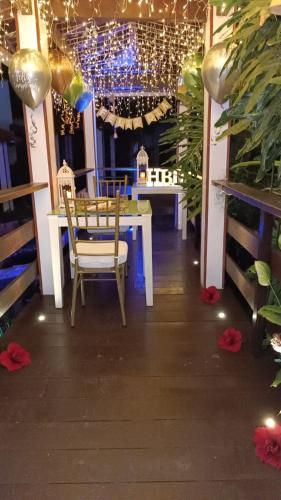a dining room with a table and chairs and lights at Hotel Mansión Barichara in Barichara