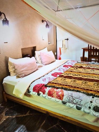 Voodi või voodid majutusasutuse Munga Eco-Lodge toas