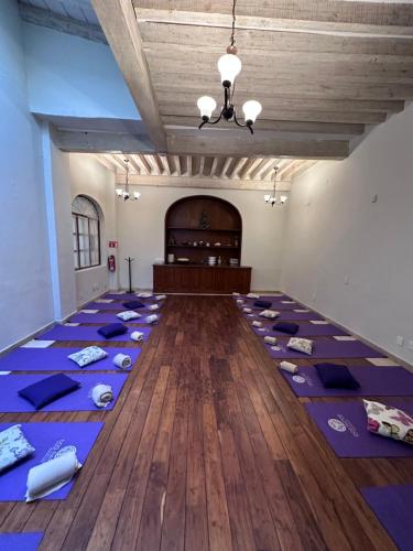 a room with purple yoga mats on the floor at Dos Patios Querétaro Curamoria Collection in Querétaro