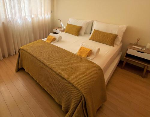 Katil atau katil-katil dalam bilik di Albufeira Lux Apartment