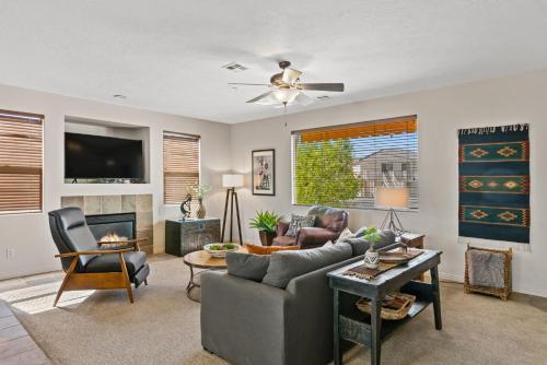 a living room with a couch and a tv at Sunny Palms #1908 condo in St. George