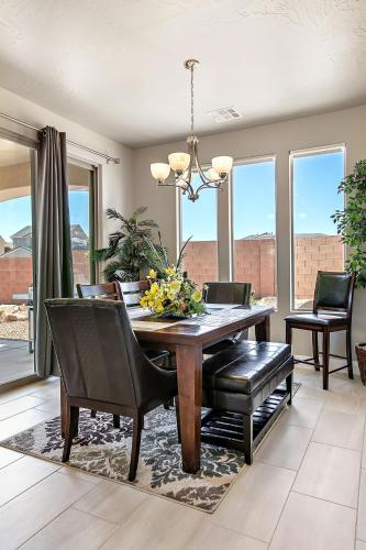 a dining room with a wooden table and chairs at Great Escape home in Washington