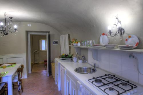 a kitchen with a sink and a counter top at Residenza Gatteschi in Pistoia