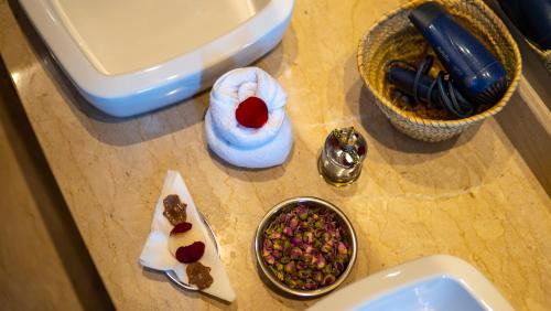 a counter top with a sink and a bowl of food at Riad villa saphir & SPA in Marrakech