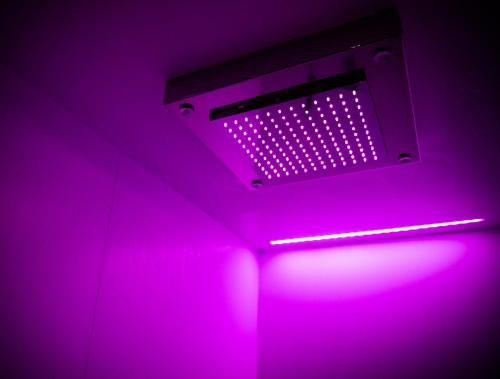 a pink light in a room with a ceiling at Residence Cà Beregana in Vicenza
