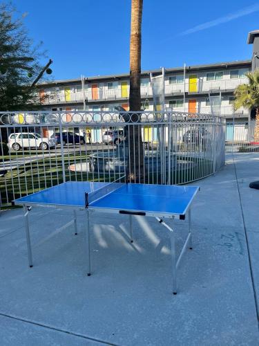 a blue ping pong table in front of a building at Bposhtels Las Vegas in Las Vegas