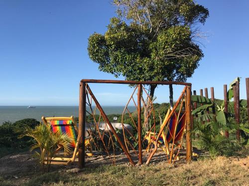 a playground on a hill next to the ocean at Kamajorú Ecohabitat in Tubará