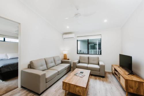 a living room with a couch and a table at Mudgee Valley Park in Mudgee