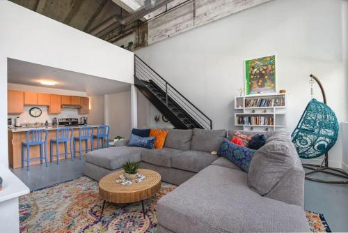 a living room with a couch and a table at 5103 Peters New Industrial Loft on Lebanon Bike Trail in Maineville