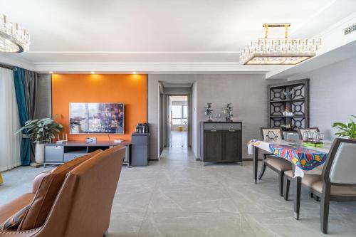 a living room with a table and chairs at Cloud & Sea Boutique Apartment in Rizhao