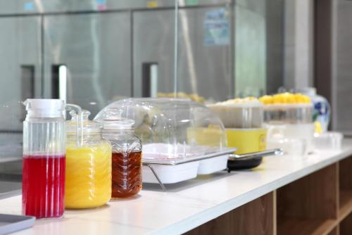 a laboratory counter with jars of liquid on a table at Lanshan Moon Resort in Yangshuo