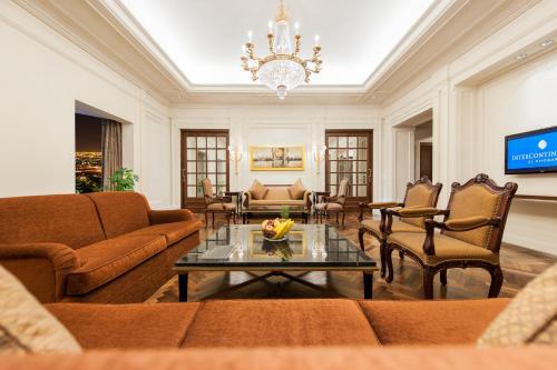 a living room with a couch and a table at InterContinental Al Khobar by IHG in Al Khobar