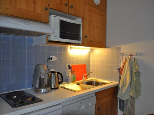 Appartement avec terrasse, casier à skis et parking couvert