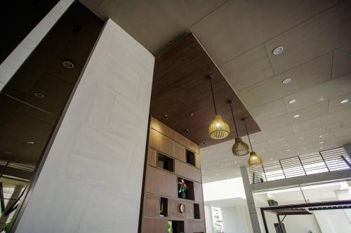 a room with two lights on the ceiling of a building at Vicar Home by Serin East Tagaytay in Tagaytay