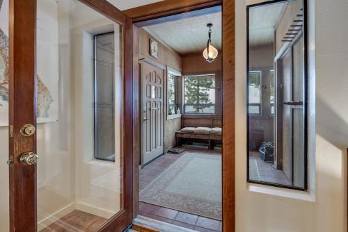 a hallway with a door and a mirror at Close to the Lake, Peaceful 5 Bedroom #343 in Tamarack