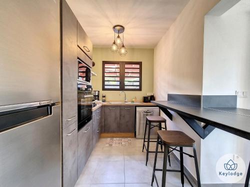Kuchyň nebo kuchyňský kout v ubytování Villa Exotika - 68m2 - Entre-Deux