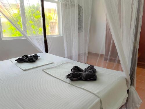Postel nebo postele na pokoji v ubytování Pearl Island Beach Hotel