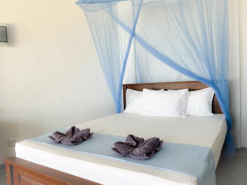 Postel nebo postele na pokoji v ubytování Pearl Island Beach Hotel