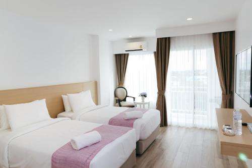 Ένα ή περισσότερα κρεβάτια σε δωμάτιο στο Arsh Boutique Hotel