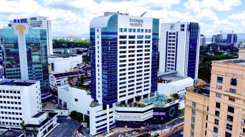 an aerial view of a city with tall buildings at Puteri Wing - Riverside Majestic Hotel in Kuching