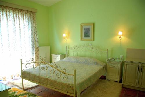 Ένα ή περισσότερα κρεβάτια σε δωμάτιο στο Ξενοδοχείο Αγνάντι