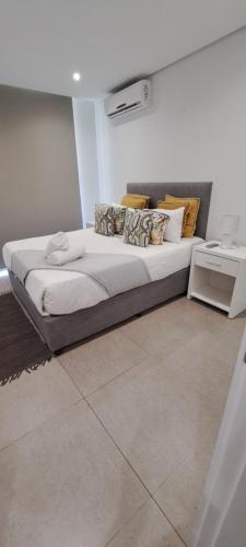 a large bed in a room with at Pebble Beach 242 in Umhlanga